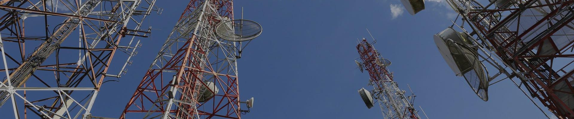 Telecommunication tower with blue sky and cloud